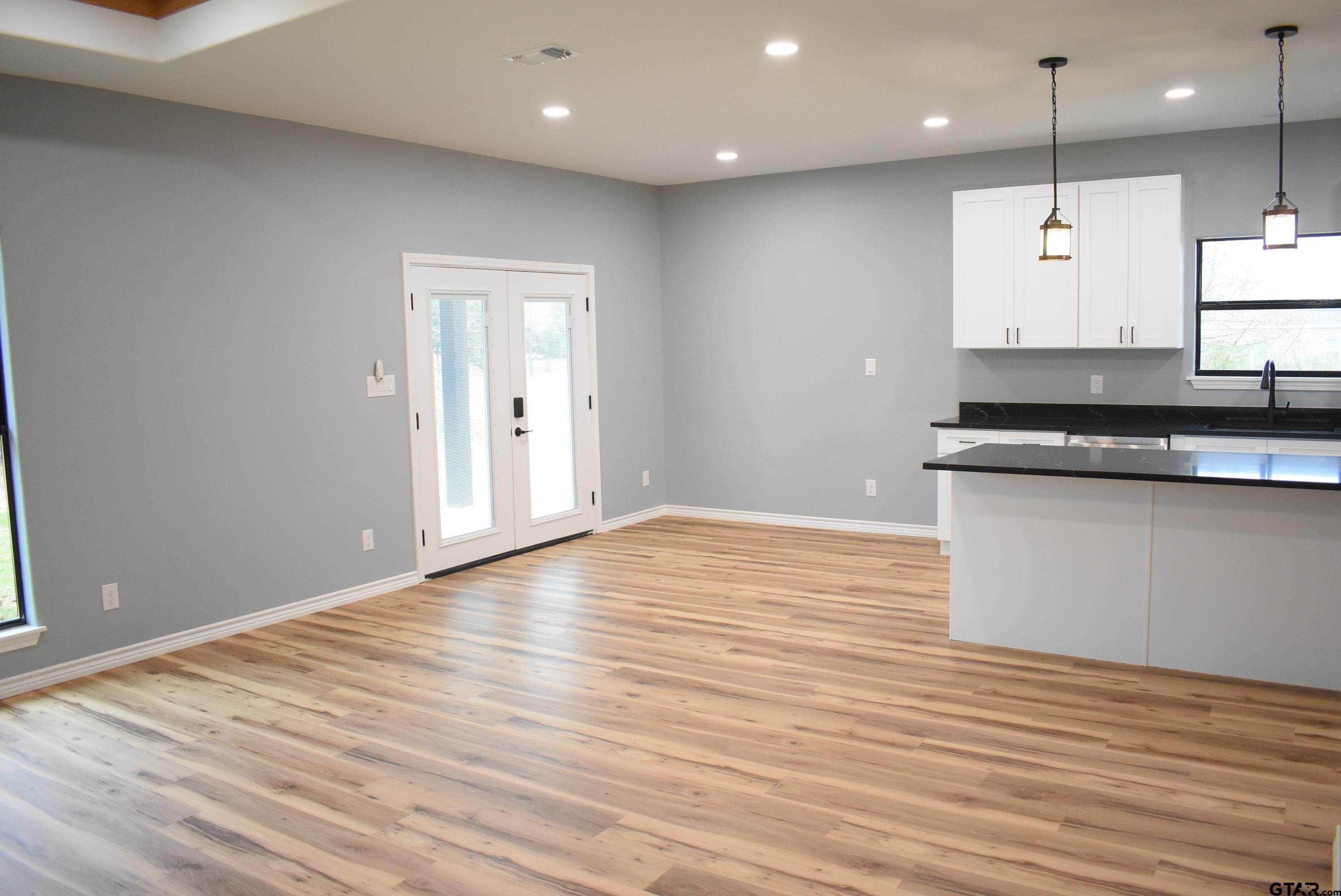 162 Ruby Lane Nacogdoches, TX 75965 - Photo 21 of 44 a large kitchen with stainless steel appliances granite countertop a granite counter tops and a wooden floor