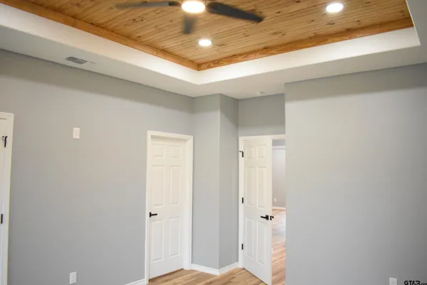 a close view of a sink and dishwasher with kitchen island