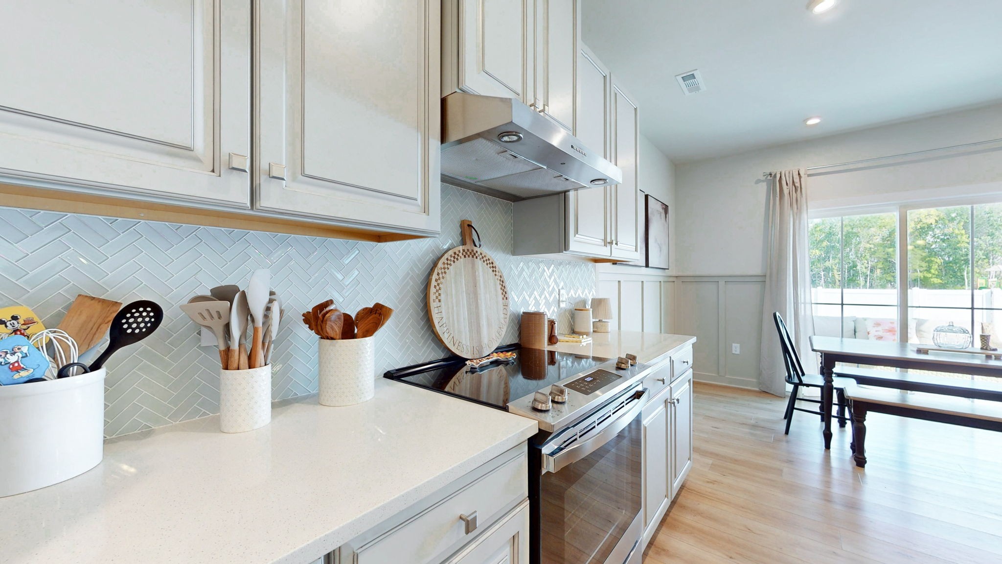 1547 Repton Road Smyrna, TN 37167 - Photo 11 of 47 a kitchen with kitchen island a stove a table and chairs in it
