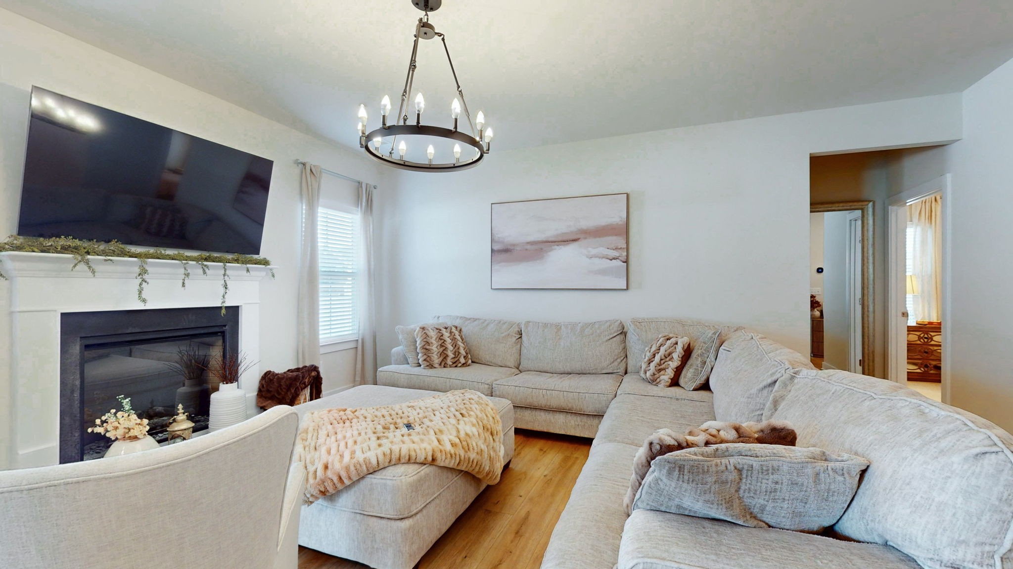 1547 Repton Road Smyrna, TN 37167 - Photo 8 of 47 a living room with furniture a flat screen tv and a fireplace