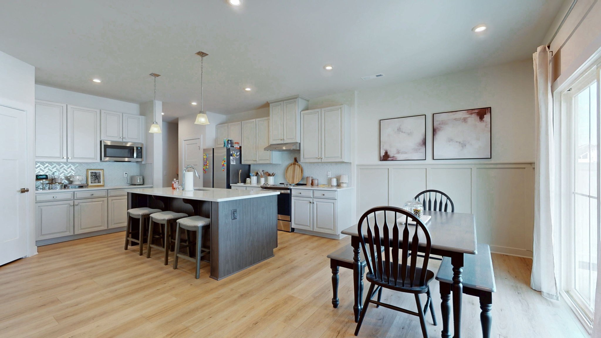 1547 Repton Road Smyrna, TN 37167 - Photo 9 of 47 a kitchen with stainless steel appliances granite countertop a table chairs sink refrigerator and microwave