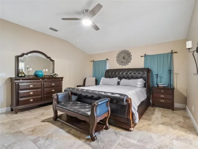 a bedroom with a bed and a dresser