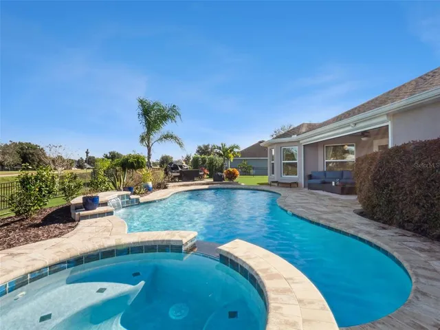 a view of a house with swimming pool