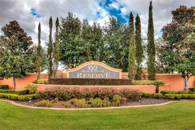 a view of a street with houses house in the background