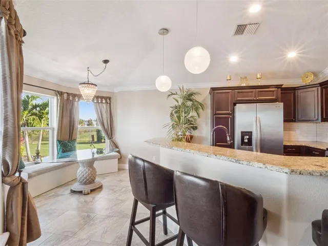 a kitchen with a table and chairs