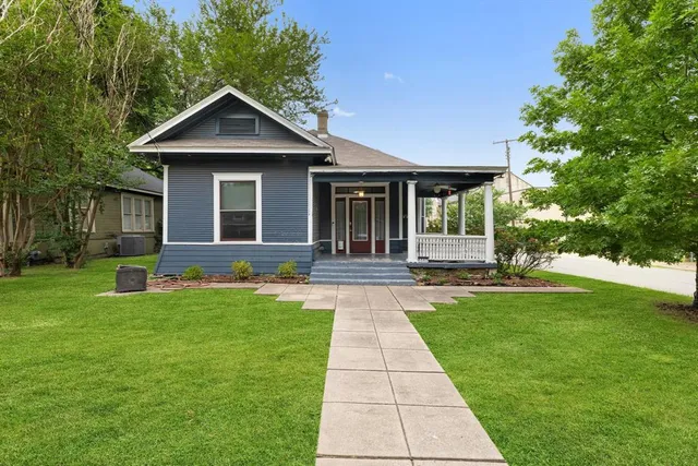 a front view of a house with yard