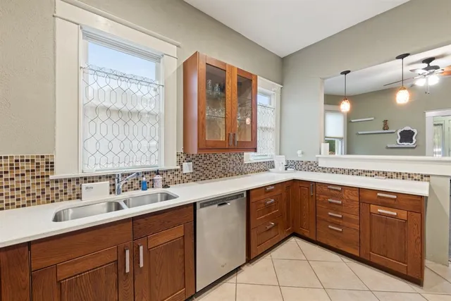 a spacious bathroom with a granite countertop sink mirror and double