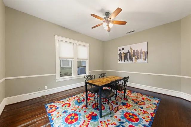 a dining room with a table and a chandelier