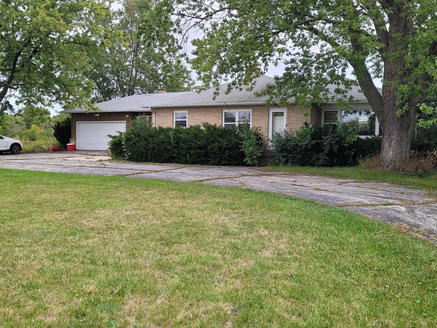 1405 Lewis Avenue Winthrop Harbor, IL 60096 - Photo 2 of 3 a view of a house with a yard and a large tree