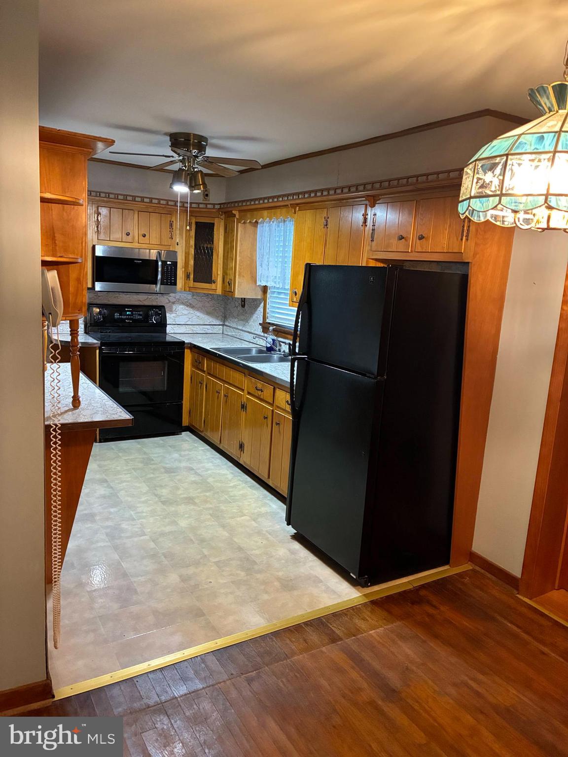 11 West Highland Avenue Enola, PA 17025 - Photo 11 of 67 a kitchen with granite countertop a refrigerator and a stove