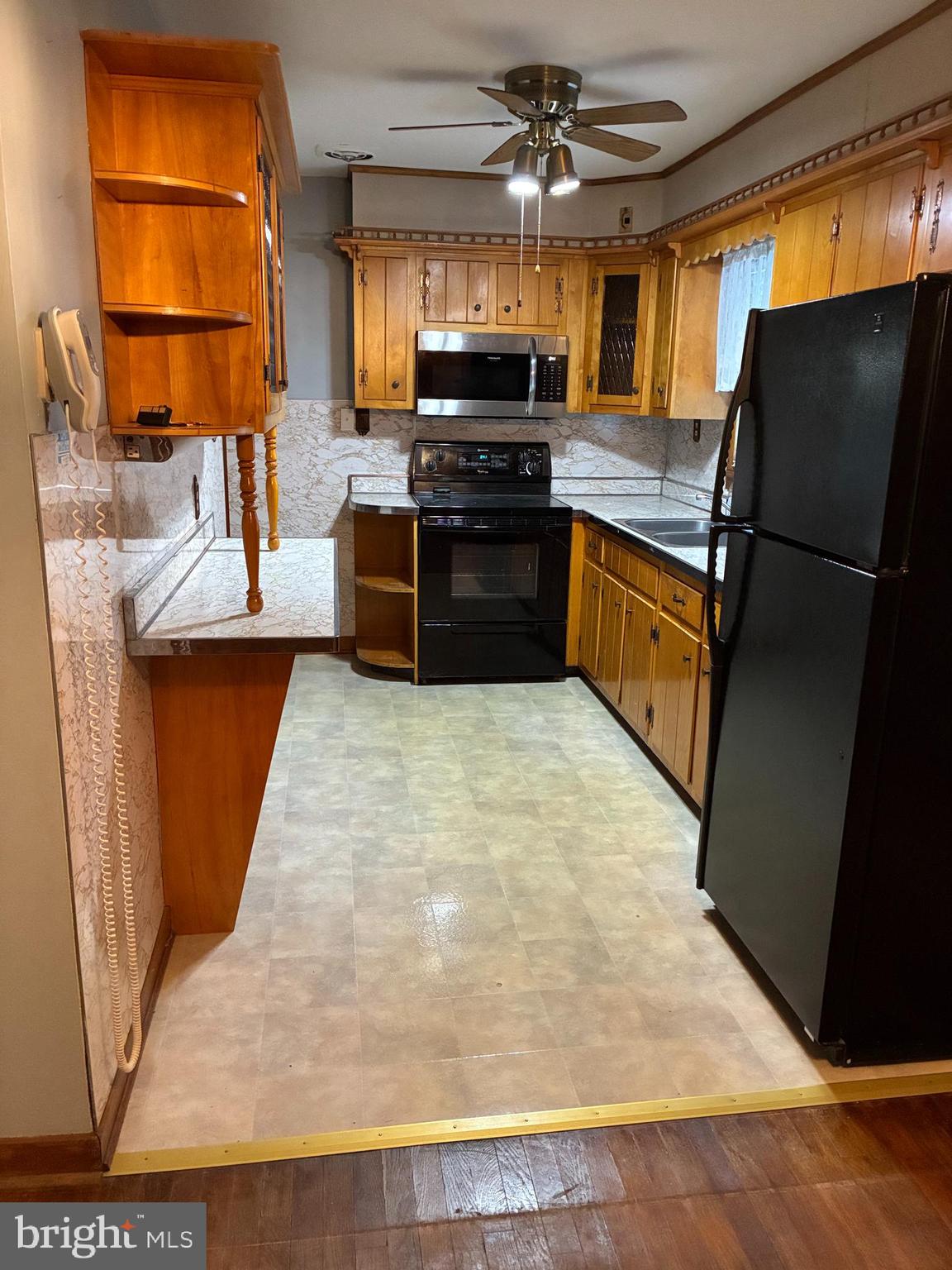 11 West Highland Avenue Enola, PA 17025 - Photo 12 of 67 a kitchen with stainless steel appliances a refrigerator and a stove top oven