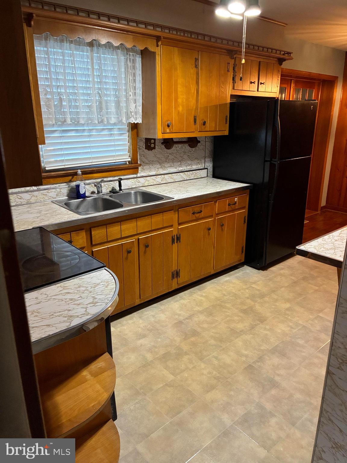 11 West Highland Avenue Enola, PA 17025 - Photo 13 of 67 a kitchen with stainless steel appliances granite countertop wooden cabinets a stove a sink and a refrigerator