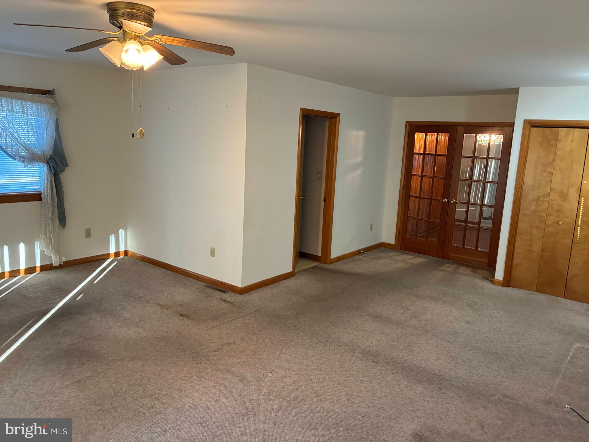 11 West Highland Avenue Enola, PA 17025 - Photo 16 of 67 a view of a livingroom with a ceiling fan and window