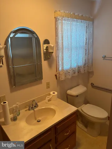 a bathroom with a sink and mirror