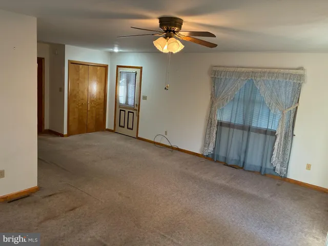 an empty room with a fireplace