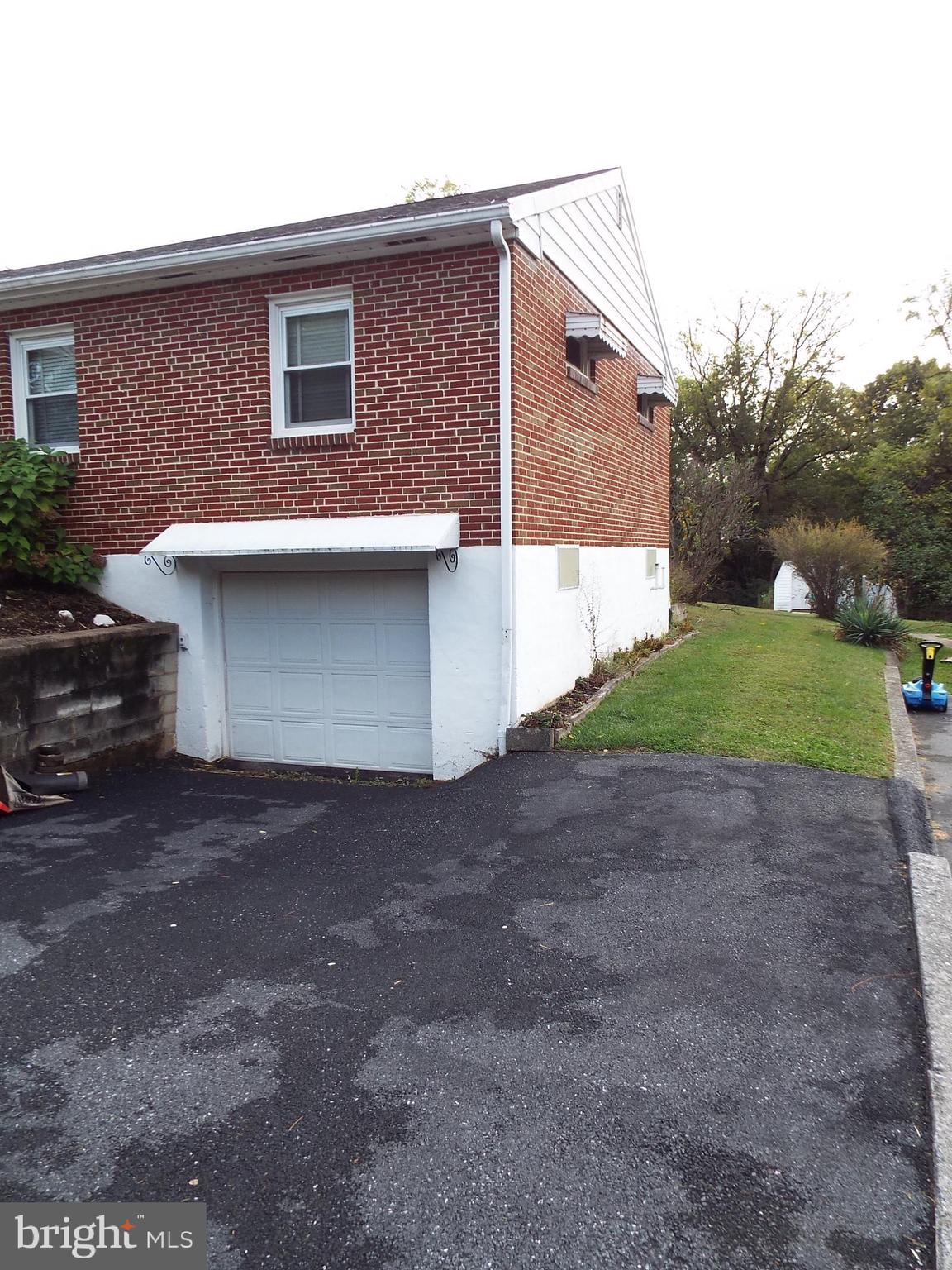 11 West Highland Avenue Enola, PA 17025 - Photo 62 of 67 a front view of a house with a yard and garage