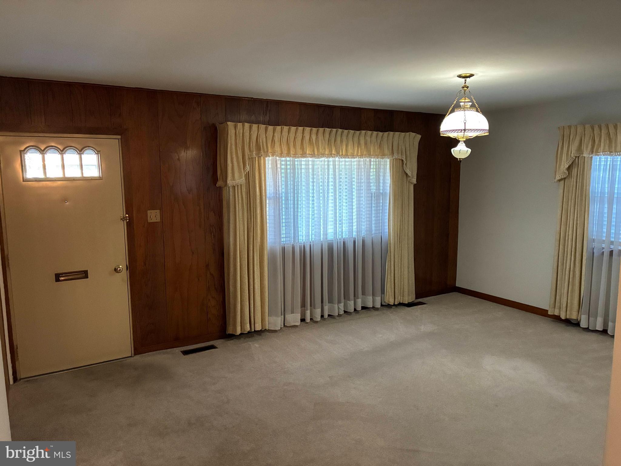 11 West Highland Avenue Enola, PA 17025 - Photo 9 of 67 an empty room with chandelier fan and windows