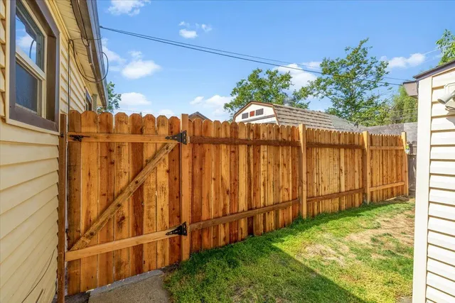 a view of a backyard with potted plants