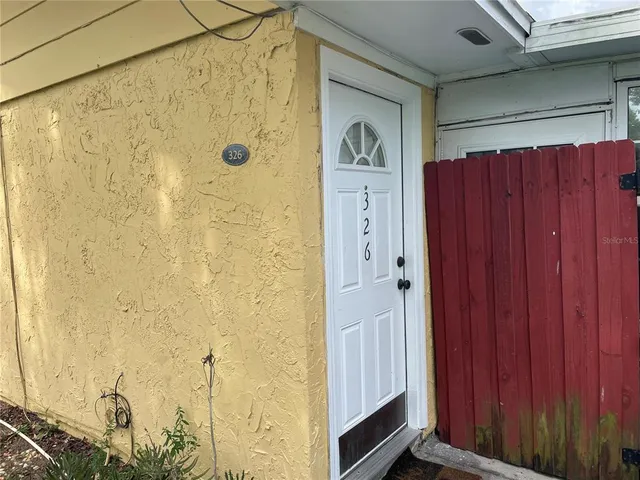 a bathroom with a shower and a sink