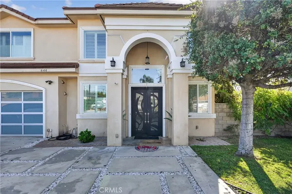 a kitchen with granite countertop a sink a stove and cabinets