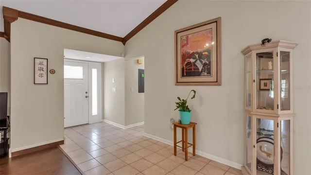 a view of an entryway with wooden floor