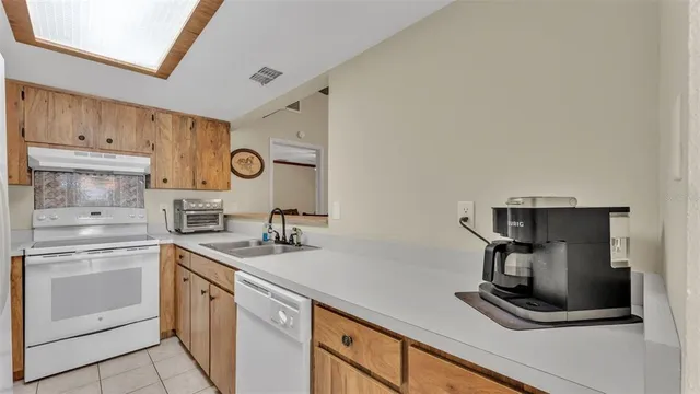 a kitchen with cabinets and appliances
