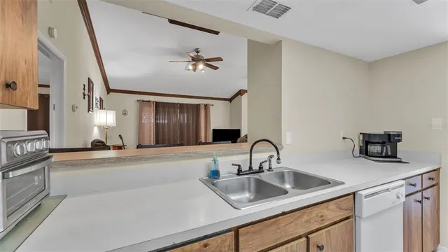 a kitchen with a sink and cabinets