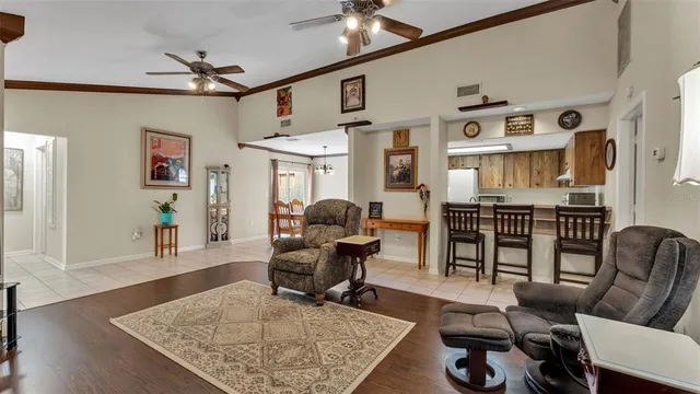 a living room with furniture rug and wooden floor