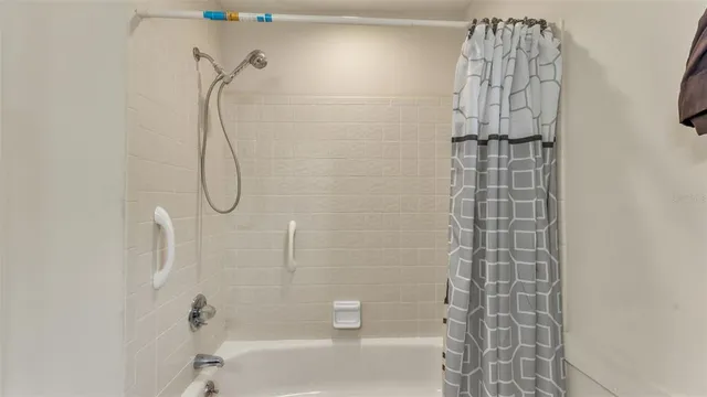 a bathroom with a shower and a shower