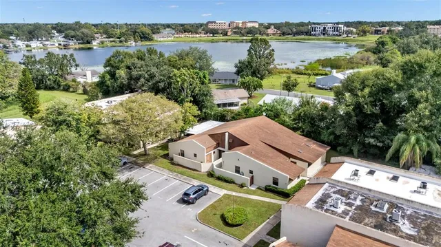 an aerial view of a house with a lake view