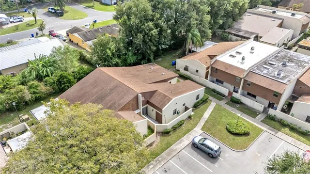 an aerial view of a house with yard swimming pool and outdoor seating