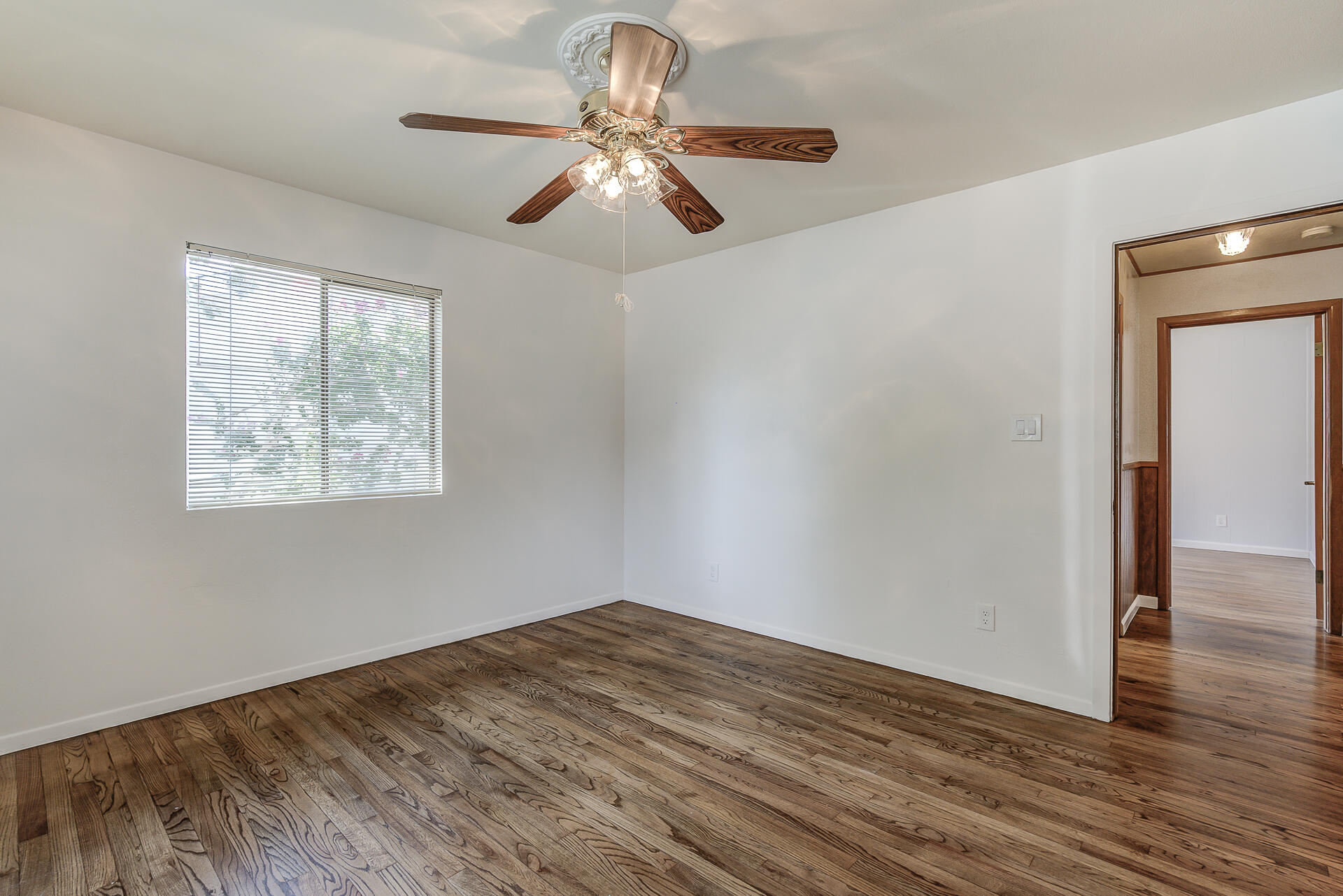 1445 Miller Way Red Bluff, CA 96080 - Photo 17 of 34 a view of empty room with wooden floor