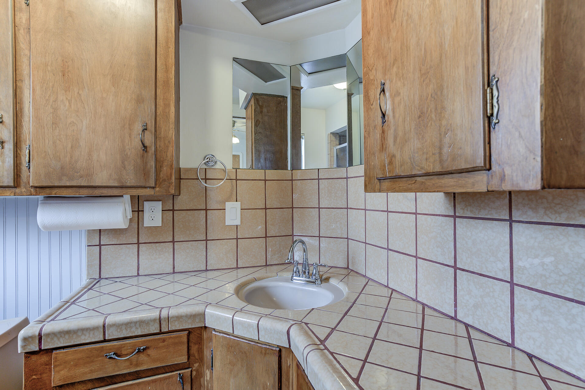 1445 Miller Way Red Bluff, CA 96080 - Photo 23 of 34 a bathroom with a sink and a mirror