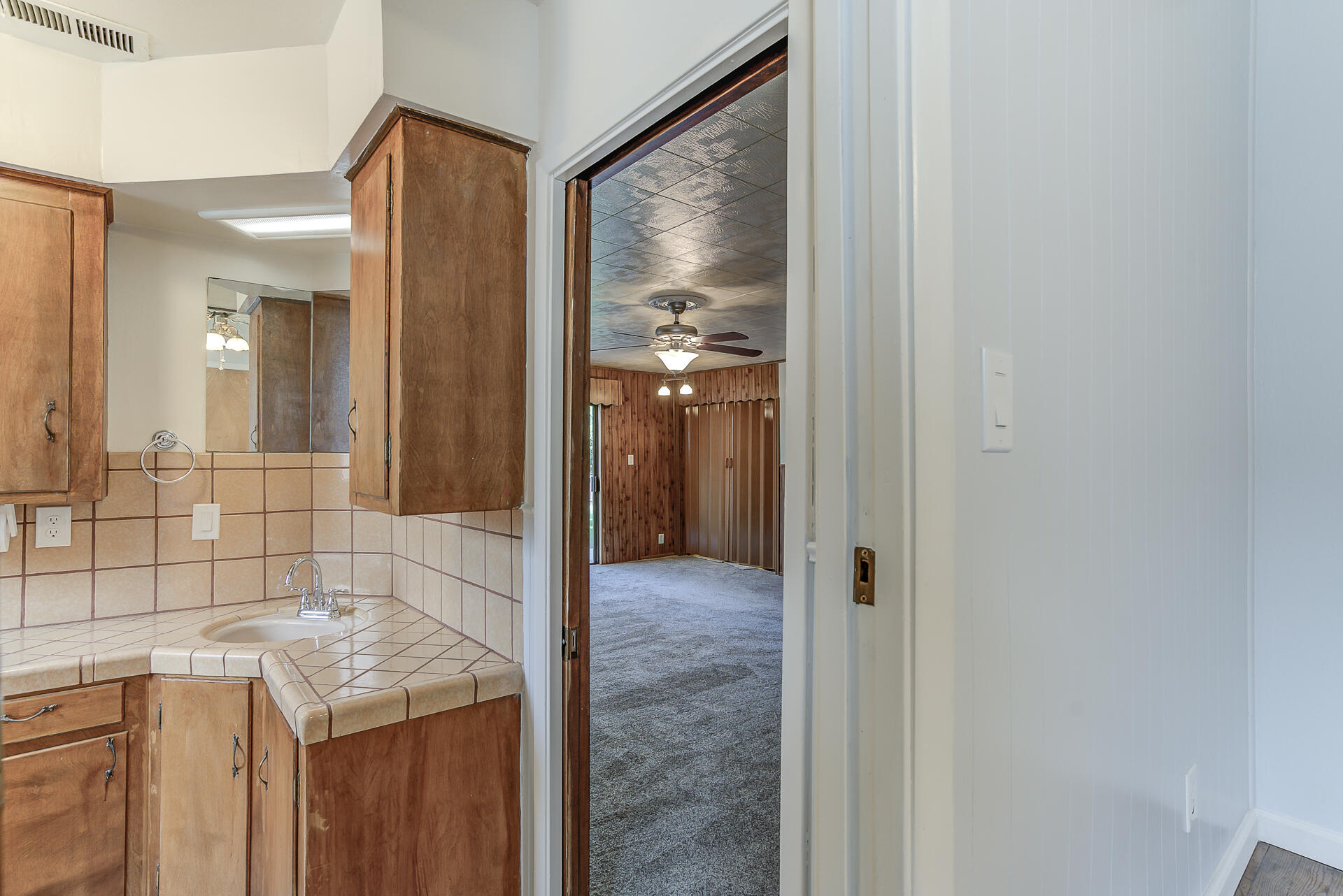 1445 Miller Way Red Bluff, CA 96080 - Photo 25 of 34 a bathroom with a granite countertop sink and shower