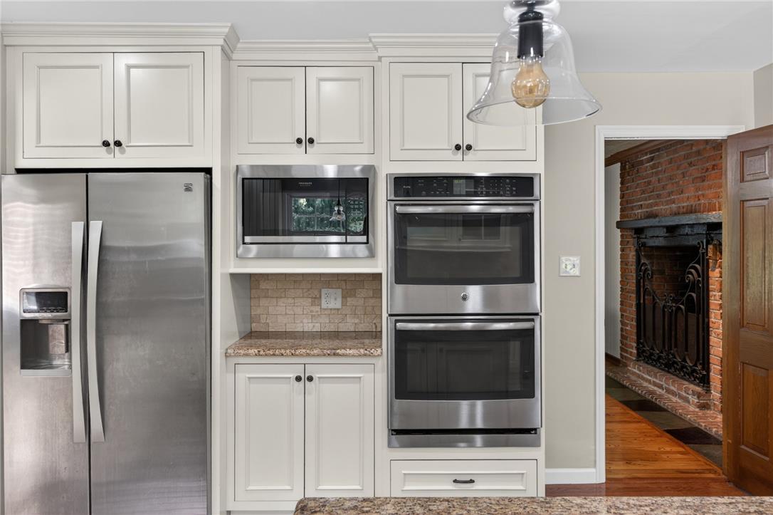 1371 Stoke Park Road Bethlehem, PA 18017 - Photo 25 of 55 a kitchen with stainless steel appliances granite countertop a refrigerator and a stove