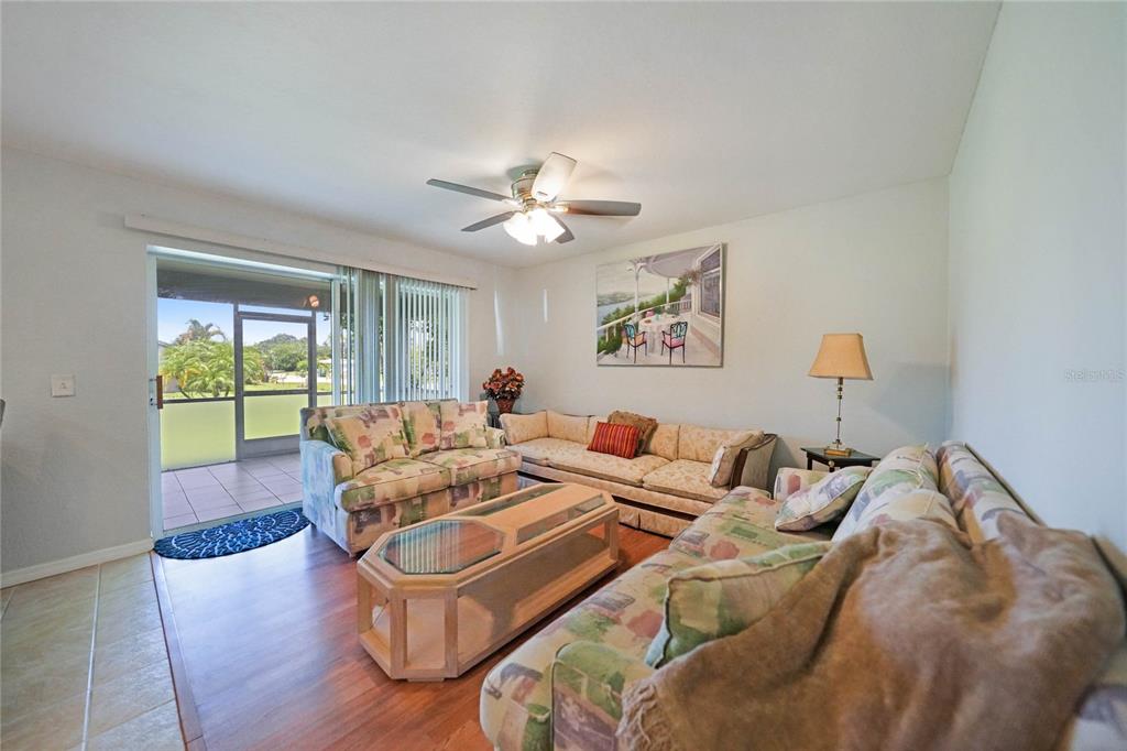 590 Ridgewood Street Northwest Port Charlotte, FL 33952 - Photo 12 of 32 a living room with furniture and a large window