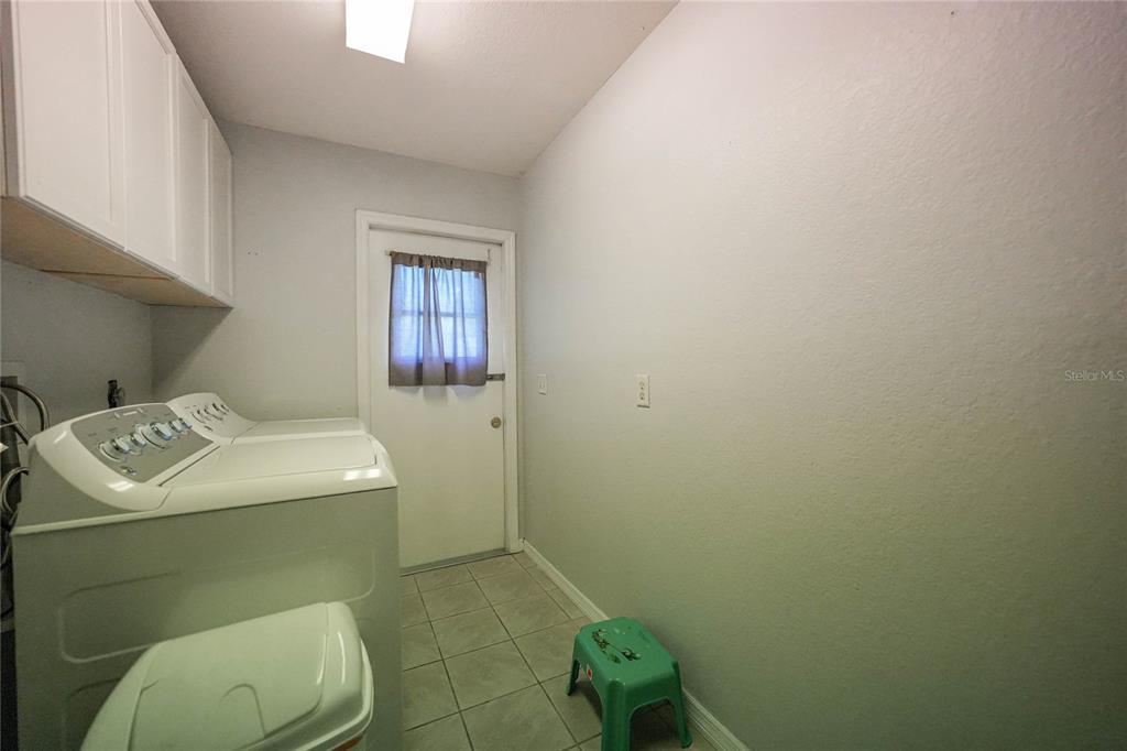 590 Ridgewood Street Northwest Port Charlotte, FL 33952 - Photo 26 of 32 a bathroom with a sink and a toilet