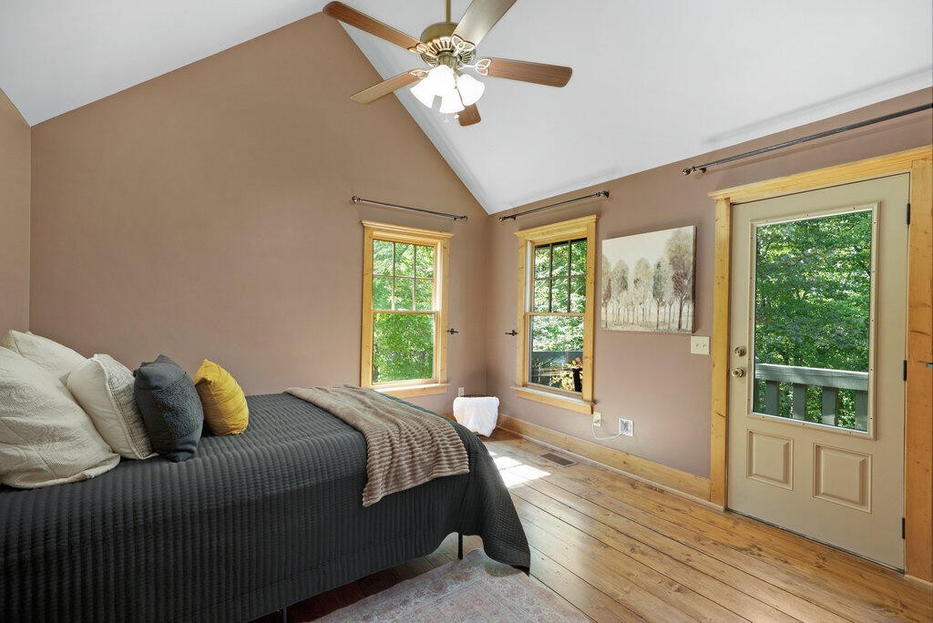 647 Omega Drive Spring City, TN 37381 - Photo 11 of 43 a bedroom with a large bed and a window