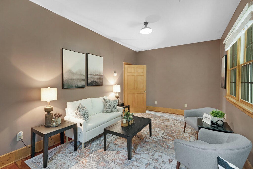 647 Omega Drive Spring City, TN 37381 - Photo 19 of 43 a living room with furniture and a potted plant