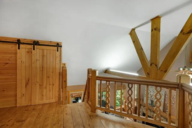 a view of entryway with hardwood and door
