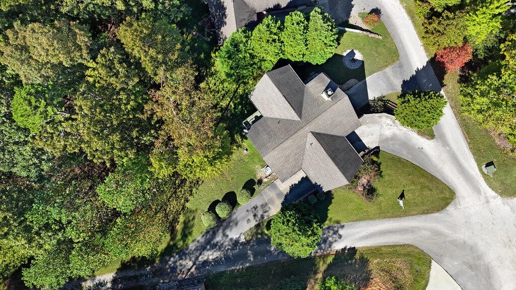 647 Omega Drive Spring City, TN 37381 - Photo 38 of 43 an aerial view of a house with a yard and garden