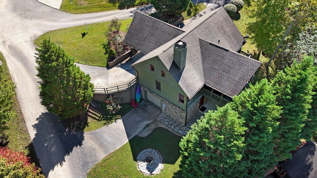 647 Omega Drive Spring City, TN 37381 - Photo 39 of 43 an aerial view of a house with a yard and garden