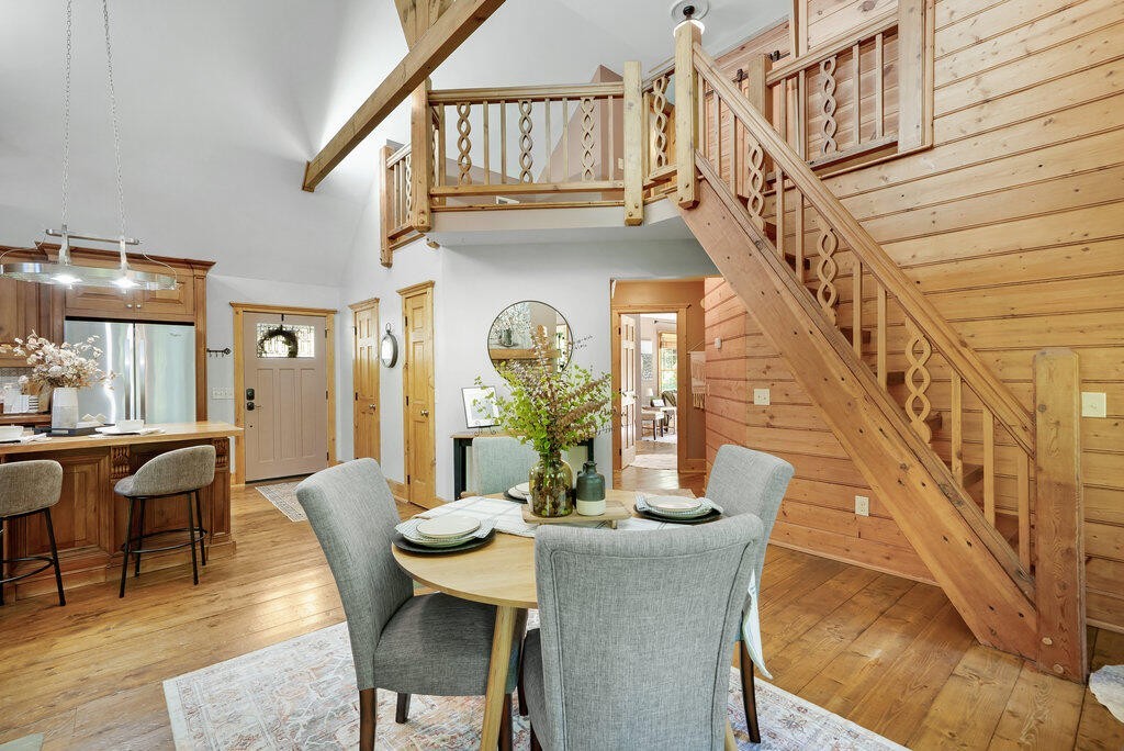 647 Omega Drive Spring City, TN 37381 - Photo 5 of 43 a view of a dining room with furniture a rug and wooden floor
