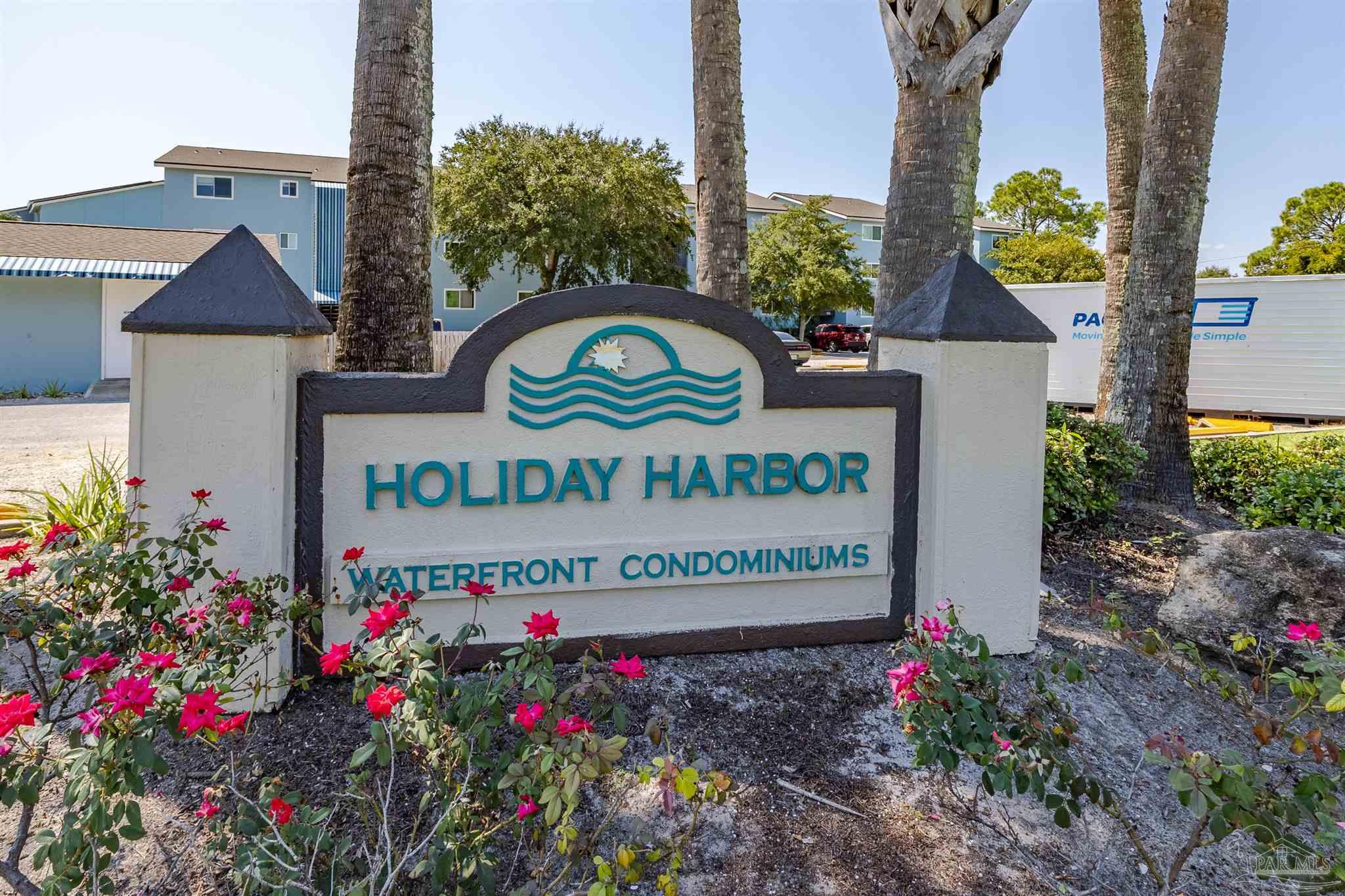 14100 River Road, Unit 228B Pensacola, FL 32507 - Photo 33 of 41 a sign on the side of a building