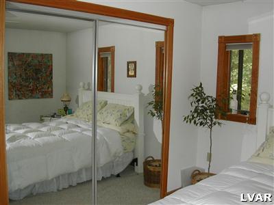 18 Hemlock Road Kunkletown, PA 18058 - Photo 17 of 37 a bedroom with a bed and a potted plant