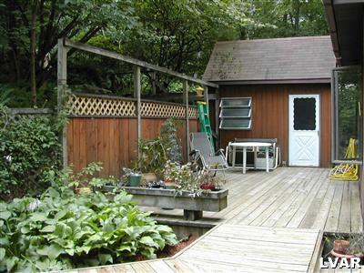 18 Hemlock Road Kunkletown, PA 18058 - Photo 26 of 37 a view of a dinning table and chairs in patio with potted plants