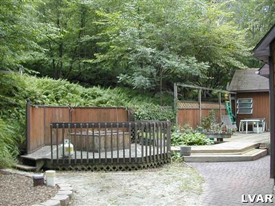 18 Hemlock Road Kunkletown, PA 18058 - Photo 32 of 37 a view of a house with a small yard and wooden fence