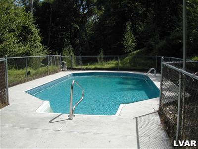 18 Hemlock Road Kunkletown, PA 18058 - Photo 37 of 37 a view of a swimming pool with a garden and trees