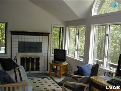 18 Hemlock Road Kunkletown, PA 18058 - Photo 9 of 37 a living room with furniture fireplace and window