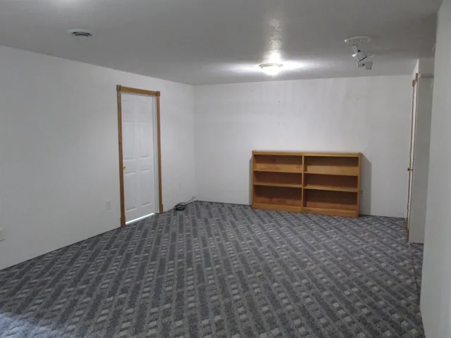 a bedroom with a bed and a cabinets